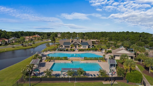 community pool featuring a water view and a patio area