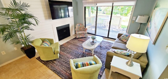 living room featuring a large fireplace