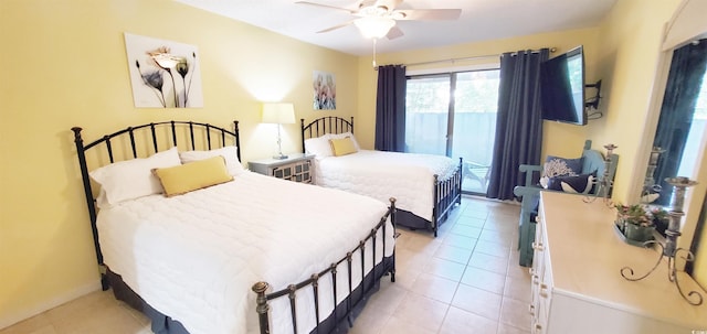 tiled bedroom with ceiling fan and access to outside