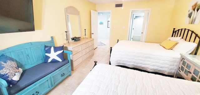 tiled bedroom with ensuite bathroom