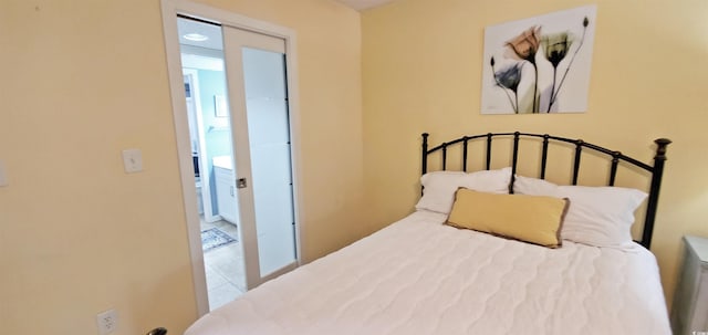 tiled bedroom featuring a closet