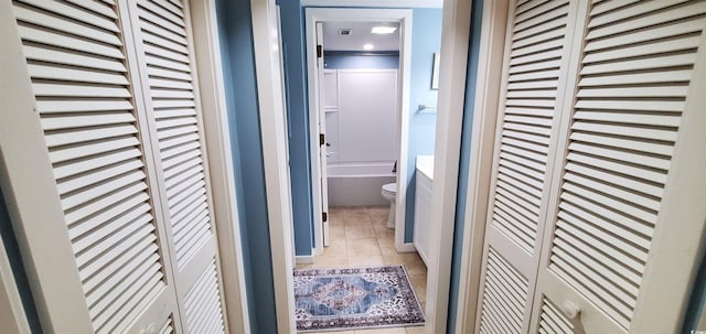 hallway featuring tile patterned floors