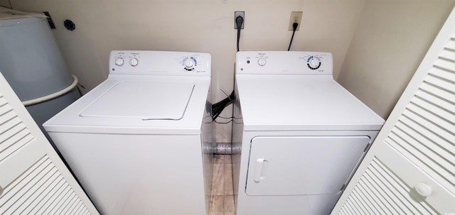 washroom with washer and dryer