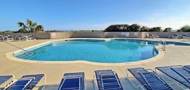 view of pool featuring a patio