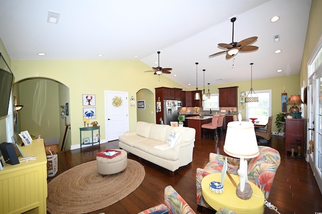 living room featuring ceiling fan, lofted ceiling, sink, and dark hardwood / wood-style flooring