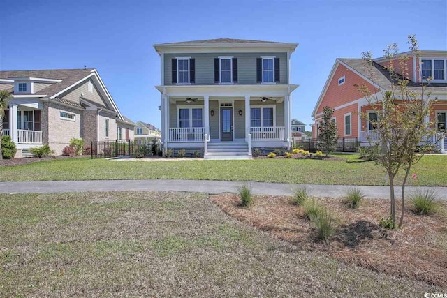 view of front of house with covered porch and a front yard