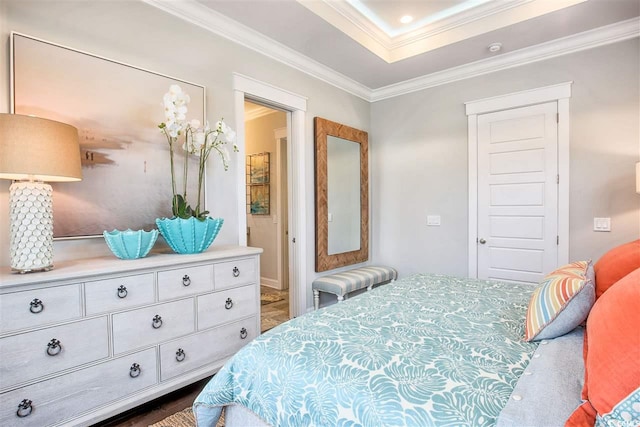 bedroom featuring crown molding and dark hardwood / wood-style flooring