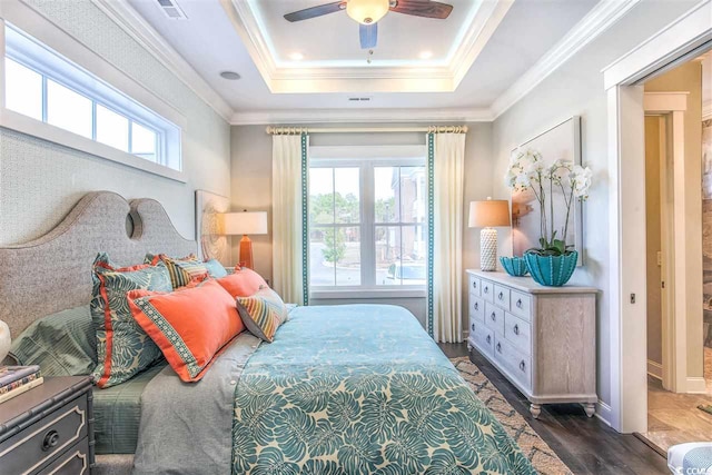 bedroom featuring multiple windows, ornamental molding, dark hardwood / wood-style floors, and ceiling fan