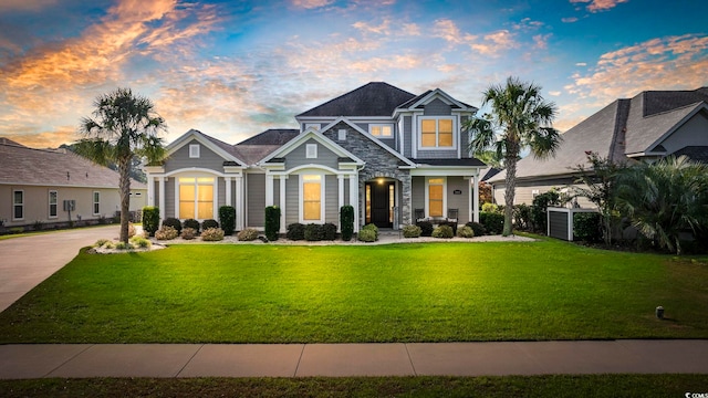 craftsman inspired home featuring a lawn