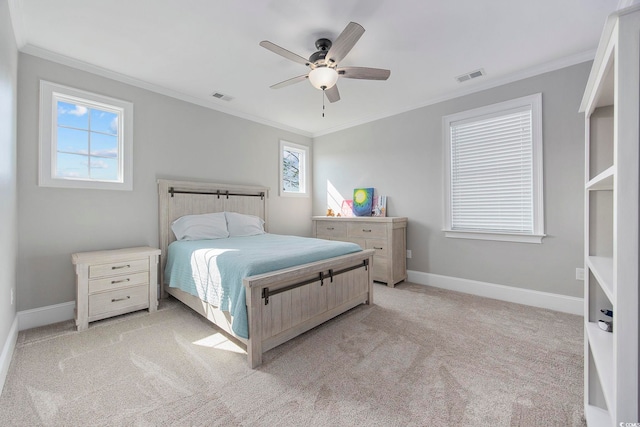 bedroom with multiple windows, light carpet, and ornamental molding