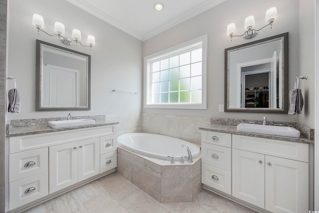 bathroom with vanity, tiled tub, ornamental molding, and tile patterned floors