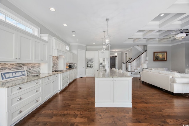 kitchen with coffered ceiling, backsplash, beam ceiling, and dark hardwood / wood-style floors