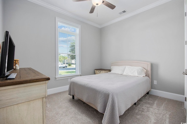 bedroom featuring light colored carpet, crown molding, and ceiling fan