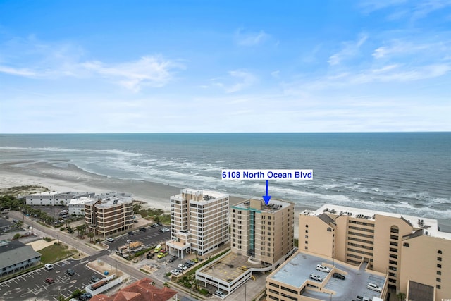 aerial view featuring a water view and a beach view