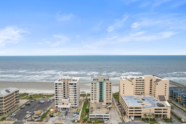 aerial view featuring a water view and a beach view