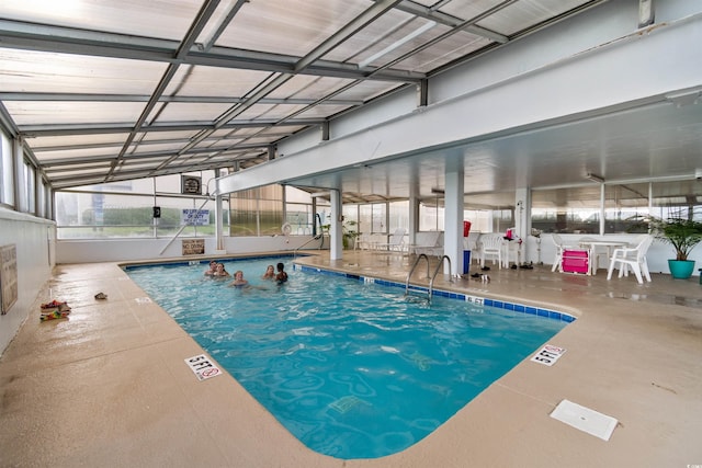 view of pool featuring a lanai and a patio area