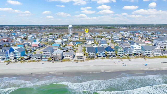 aerial view featuring a view of the beach and a water view