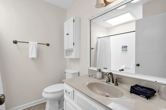 bathroom featuring tile patterned floors, vanity, toilet, and a shower with shower curtain