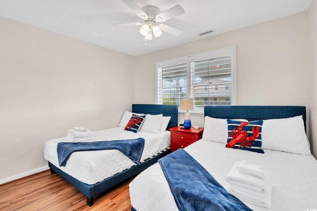 bedroom featuring ceiling fan and light wood-type flooring