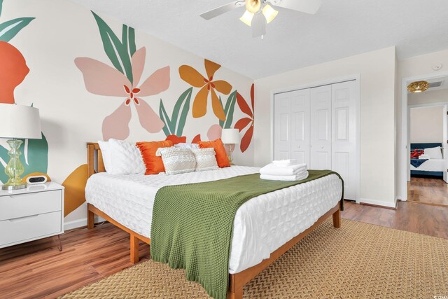 bedroom featuring a closet, ceiling fan, and hardwood / wood-style flooring