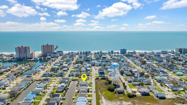 drone / aerial view featuring a water view and a city view