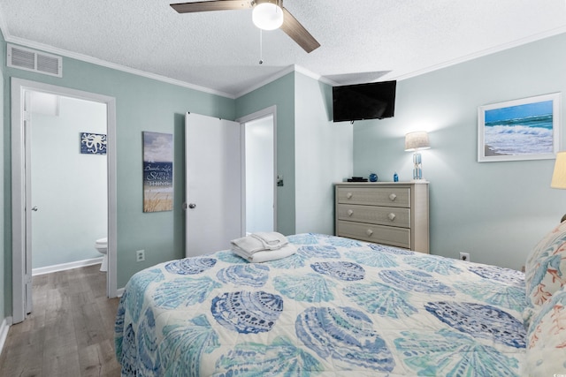 bedroom with ornamental molding, ceiling fan, hardwood / wood-style flooring, and a textured ceiling