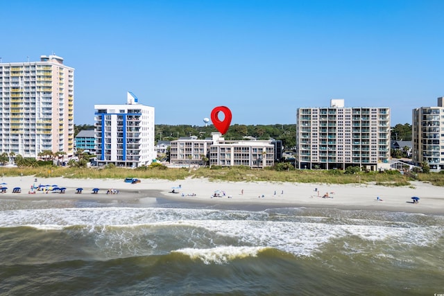 bird's eye view with a water view and a view of the beach