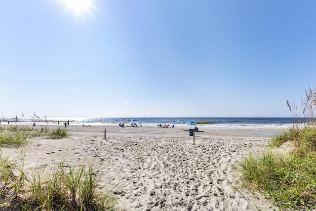 property view of water featuring a beach view