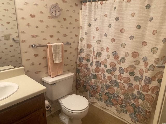 bathroom featuring walk in shower, toilet, and vanity