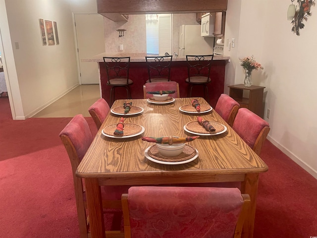 view of carpeted dining room