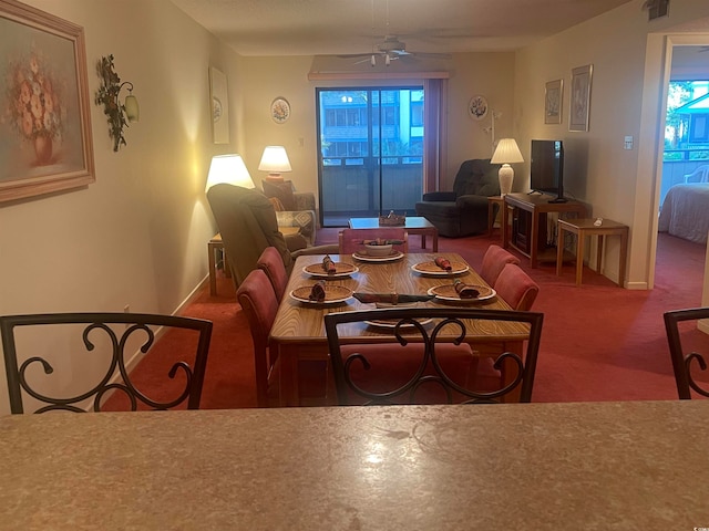 carpeted living room featuring ceiling fan