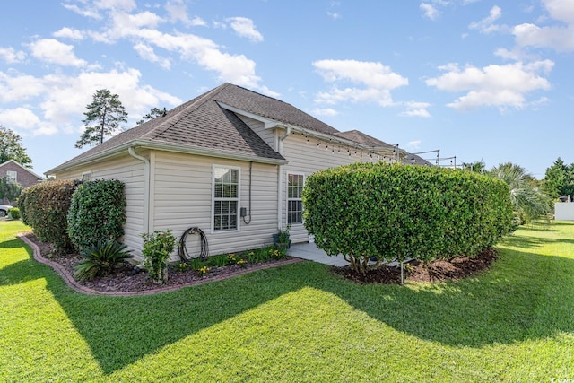 view of property exterior with a lawn