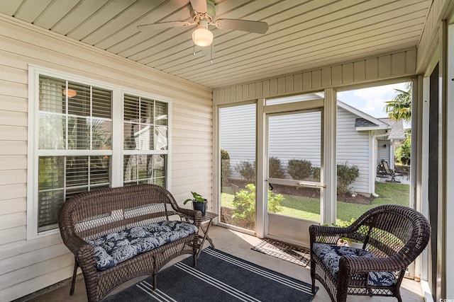 sunroom / solarium with wood ceiling and ceiling fan