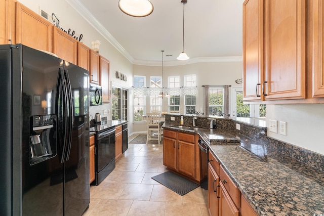 kitchen featuring sink, light tile patterned floors, dark stone countertops, pendant lighting, and black appliances