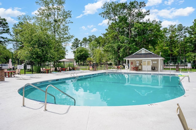 view of swimming pool featuring a patio area