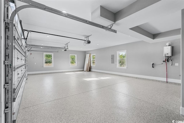 garage featuring electric panel and water heater