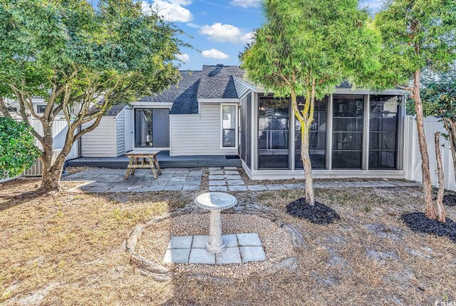 rear view of house featuring a patio area