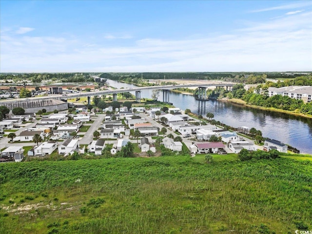 birds eye view of property with a water view and a residential view