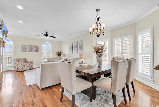 dining area featuring baseboards, light wood finished floors, recessed lighting, and crown molding