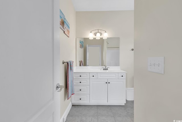 bathroom featuring vanity and baseboards