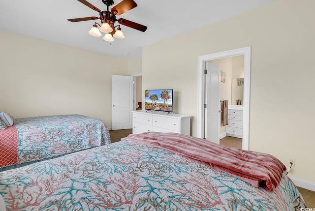 carpeted bedroom with ensuite bathroom, a ceiling fan, and baseboards