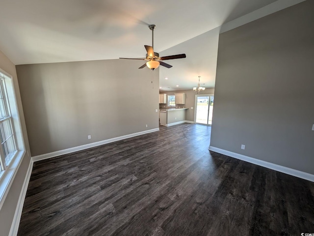 TBD1 Mineral Springs Rd, Conway, SC 29527 - unfurnished living room with ceiling fan, dark wood-style floors, a chandelier, lofted ceiling, and baseboards