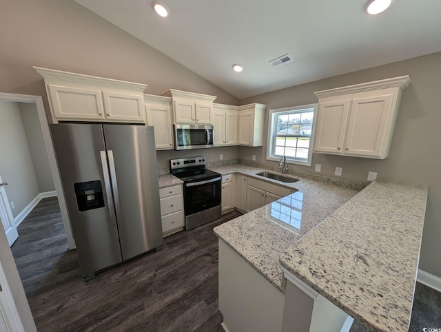 TBD1 Mineral Springs Rd, Conway, SC 29527 - kitchen featuring appliances with stainless steel finishes, a sink, a peninsula, white cabinetry, and vaulted ceiling