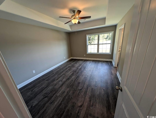 TBD1 Mineral Springs Rd, Conway, SC 29527 - spare room with a tray ceiling, dark wood-style floors, a ceiling fan, and baseboards