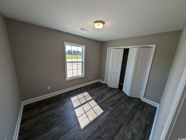 TBD1 Mineral Springs Rd, Conway, SC 29527 - unfurnished bedroom with dark wood-type flooring, baseboards, and a closet