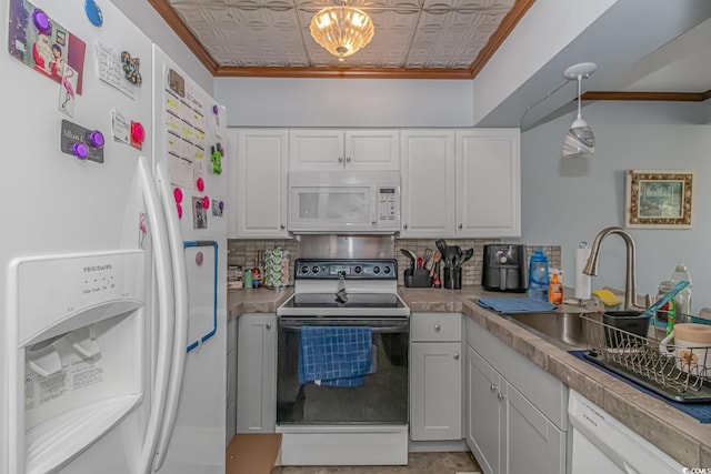 kitchen with ornamental molding, white appliances, white cabinetry, and decorative backsplash