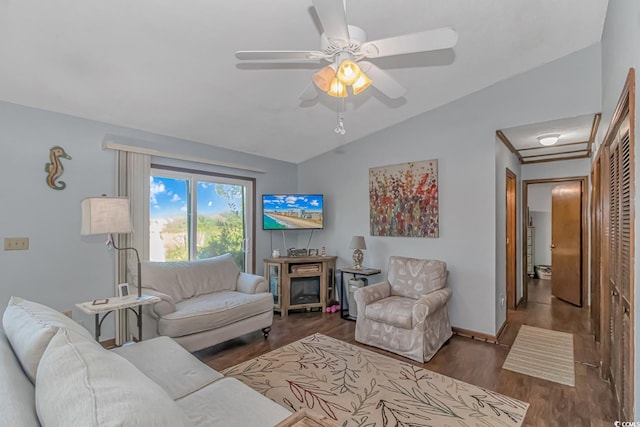 living room featuring lofted ceiling, ceiling fan, and dark hardwood / wood-style floors