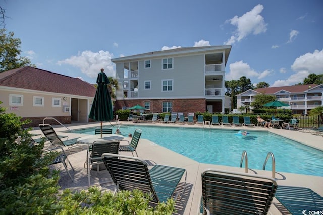 view of swimming pool featuring a patio