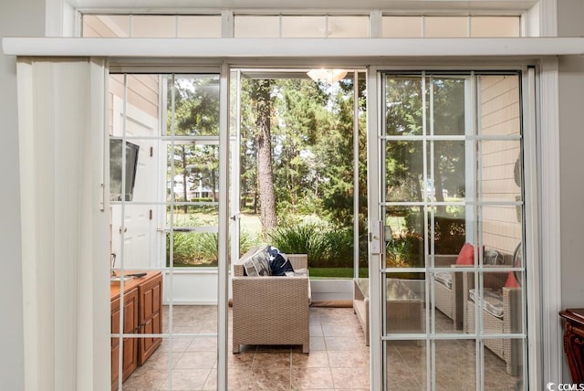 doorway to outside featuring light tile patterned floors