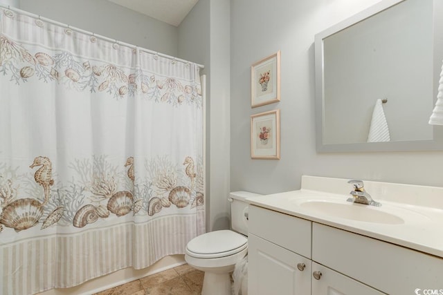 bathroom featuring vanity, tile patterned floors, and toilet